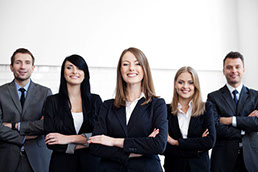 Image of smiling confident business team